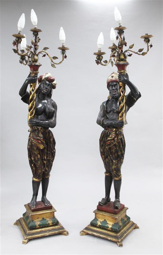 A pair of painted and giltwood blackamoor torcheres, H.6ft